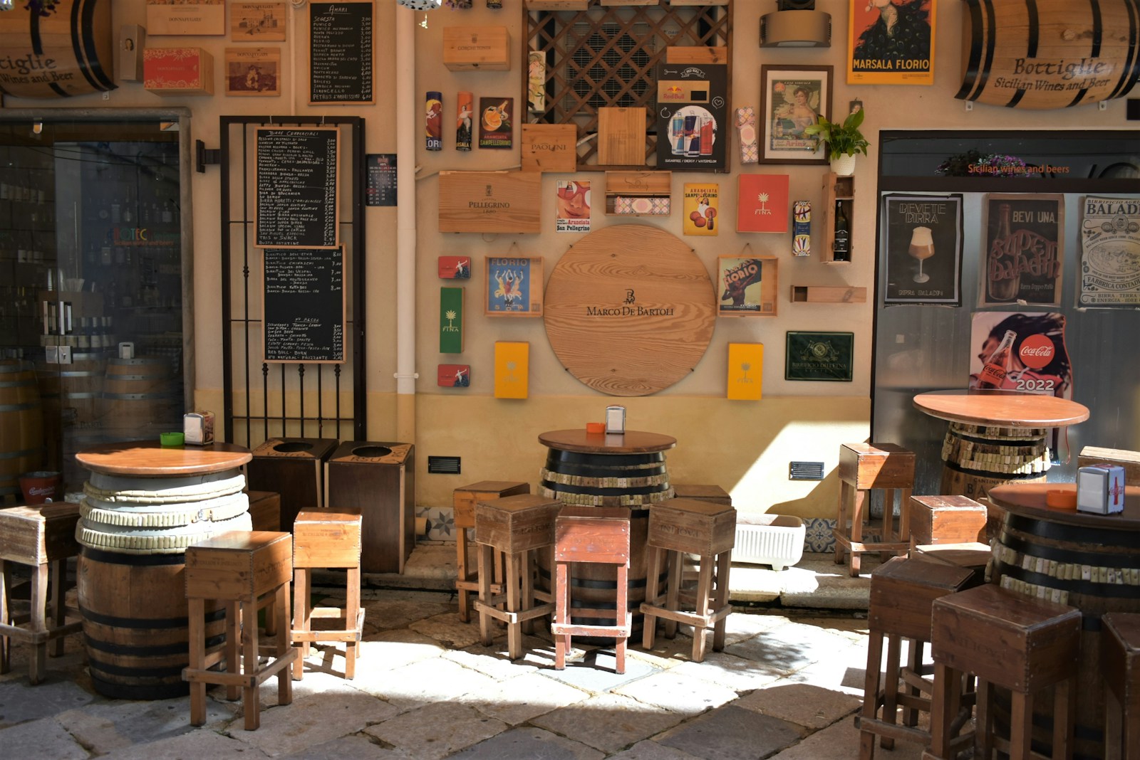 a room full of many wooden tables and chairs