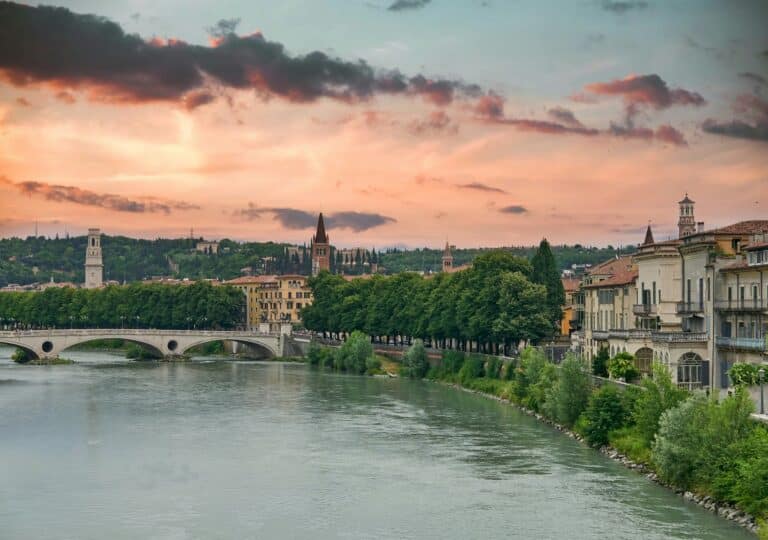 Amazing cityscape with dramatic sky over river in Verona.