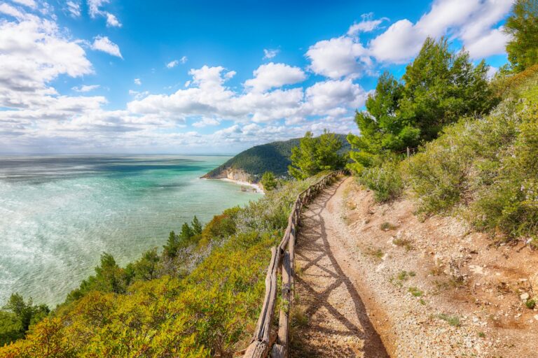 Picturesque islets Faraglioni di Puglia in summer Adriatic sea bay Baia Delle Zagare