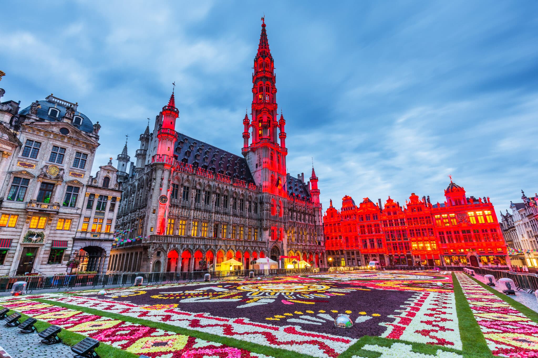 Grand Place Brussels lit up at sunset.