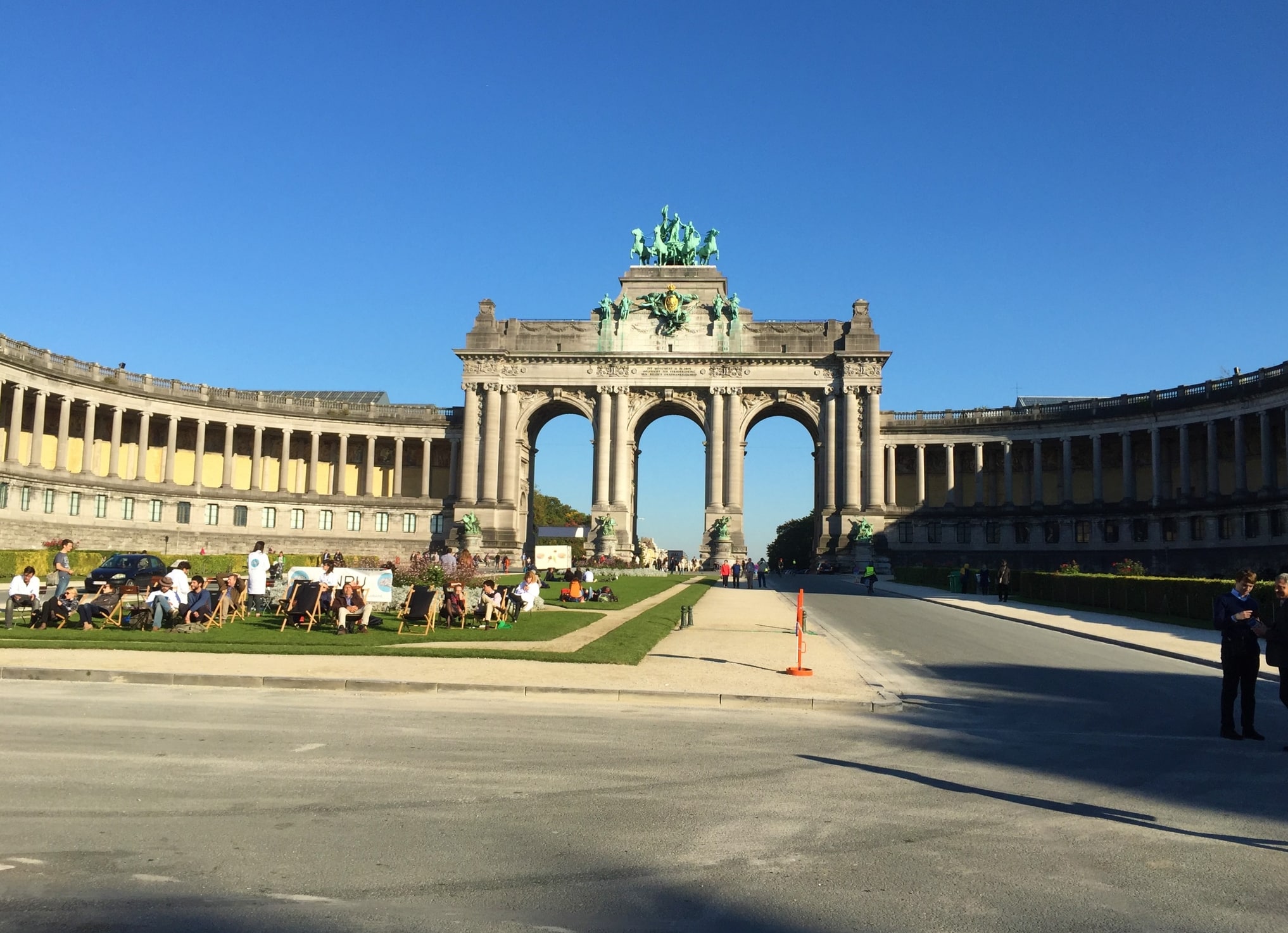 Triumphal Arch and people relaxing in the park