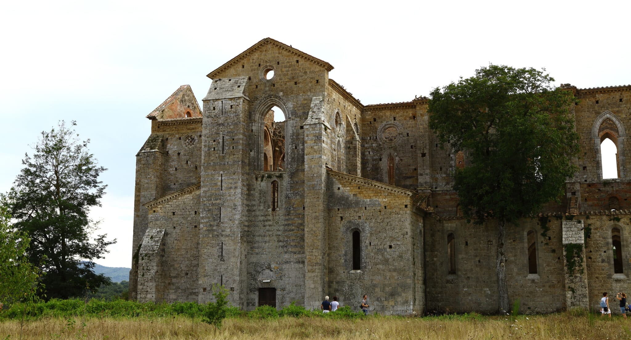 Ruined Gothic abbey in the Italian countryside.