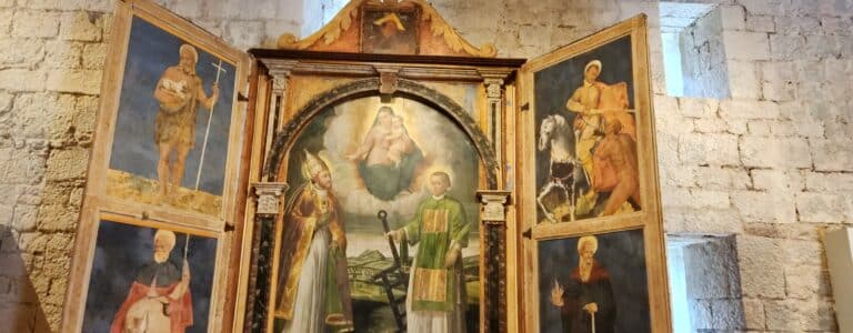 Antique altar with religious paintings in church