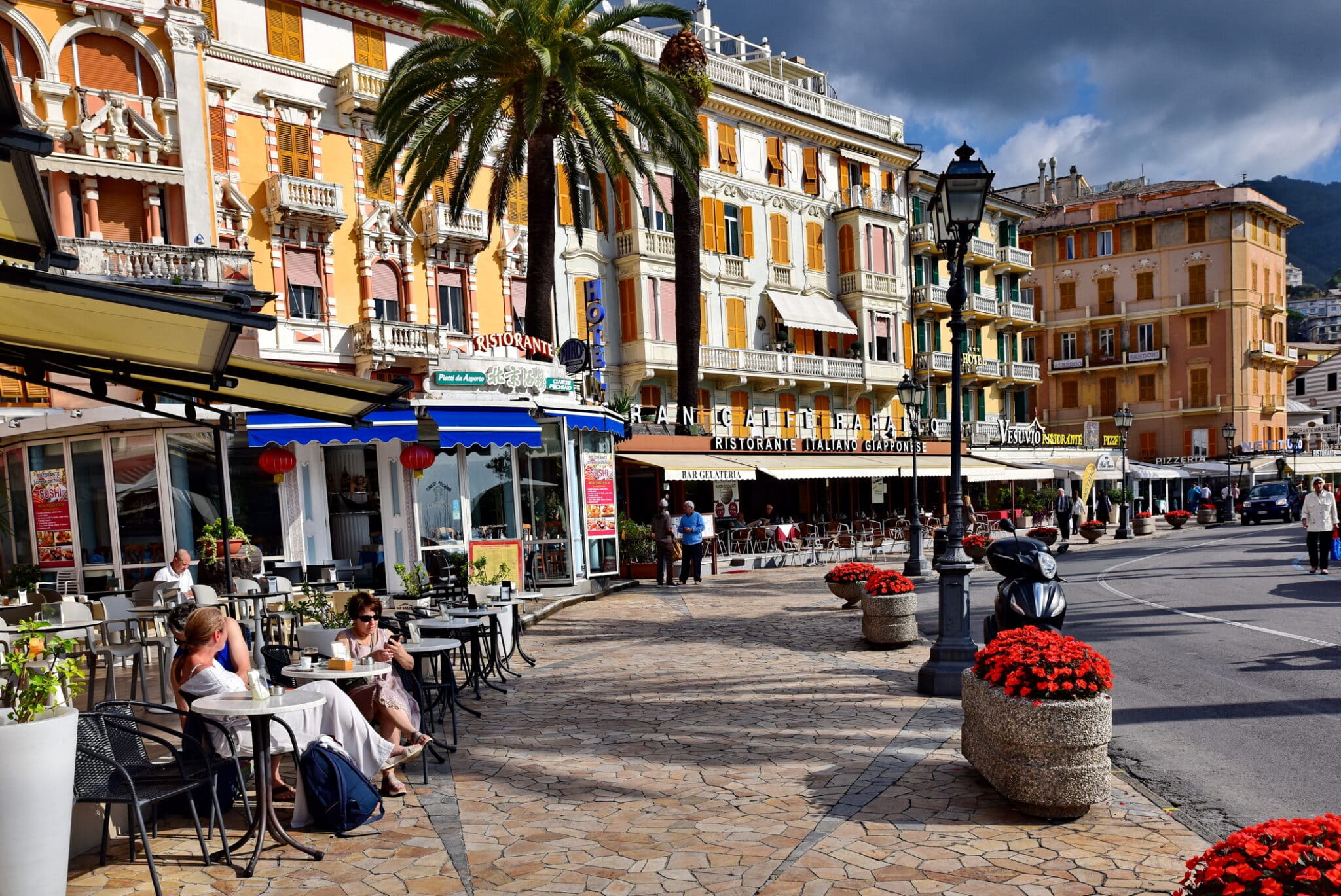 The Rapallo waterfront in the Liguria region of Italy. Rapallo is a picturesque town in the Liguria region of Italy, and is highlighted by numerous cafés and a long promenade.