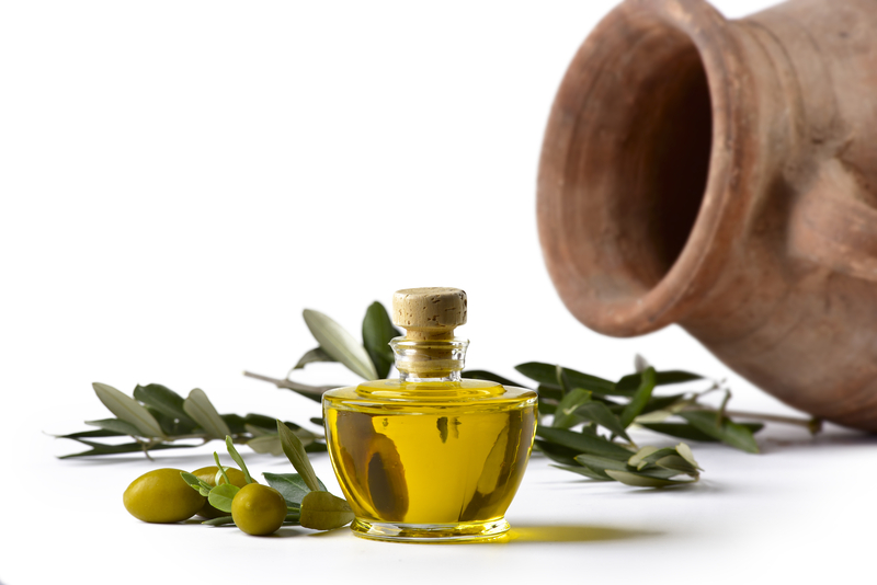 Bottle of olive oil with olives and amphora